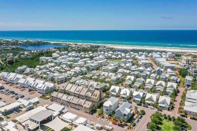 aerial view featuring a water view and a beach view