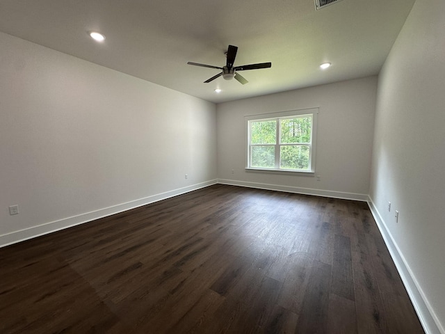 unfurnished room with dark wood-style flooring, ceiling fan, recessed lighting, and baseboards