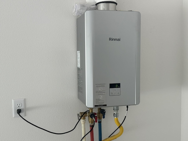 utility room with water heater