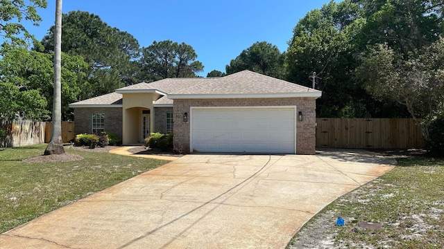 ranch-style home with a front lawn and a garage