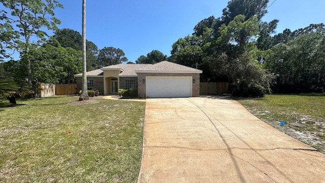 single story home with a garage and a front lawn