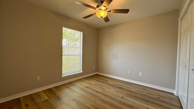 empty room featuring ceiling fan and light hardwood / wood-style flooring