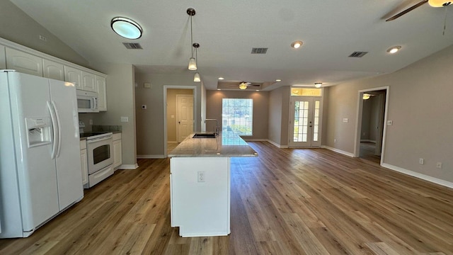 kitchen featuring white appliances, ceiling fan, white cabinets, and decorative light fixtures