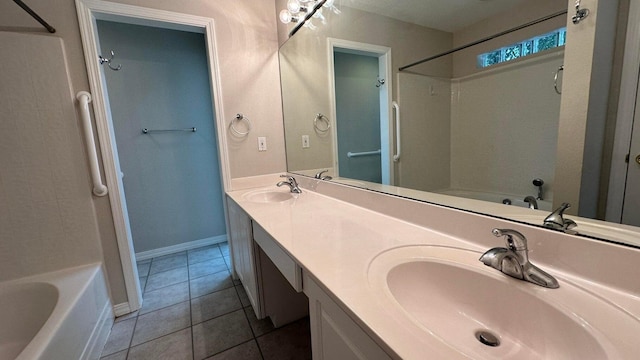 bathroom with washtub / shower combination, tile patterned flooring, and vanity