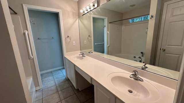 bathroom with vanity, tile patterned floors, and shower / bathtub combination