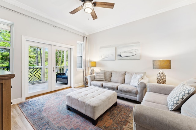 living room featuring crown molding, french doors, ceiling fan, and hardwood / wood-style flooring