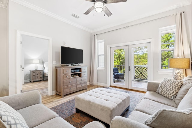 living room featuring ceiling fan, light hardwood / wood-style floors, ornamental molding, and french doors