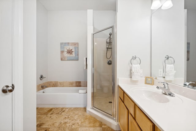 bathroom featuring separate shower and tub and vanity