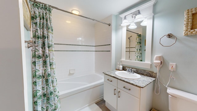 full bathroom with vanity, shower / bath combination with curtain, and toilet