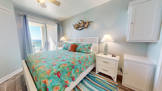 bedroom featuring access to outside, ceiling fan, and dark wood-type flooring