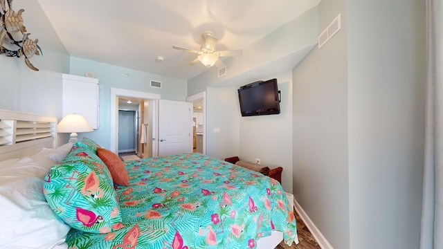 bedroom with hardwood / wood-style flooring, ceiling fan, and ensuite bathroom