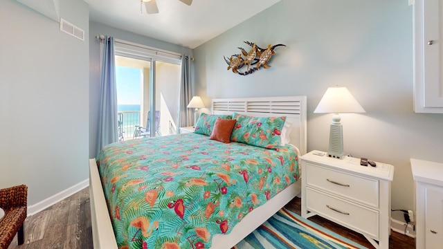 bedroom featuring ceiling fan, dark hardwood / wood-style floors, and access to outside