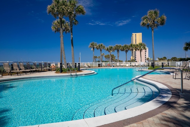 view of swimming pool with a patio