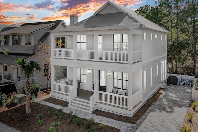 view of front of home featuring a porch and a balcony