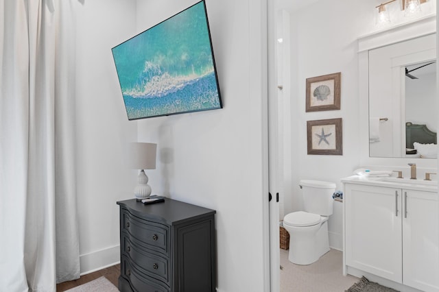 bathroom featuring vanity and toilet