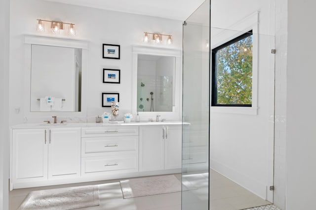 bathroom with vanity, tile patterned floors, and a shower with shower door