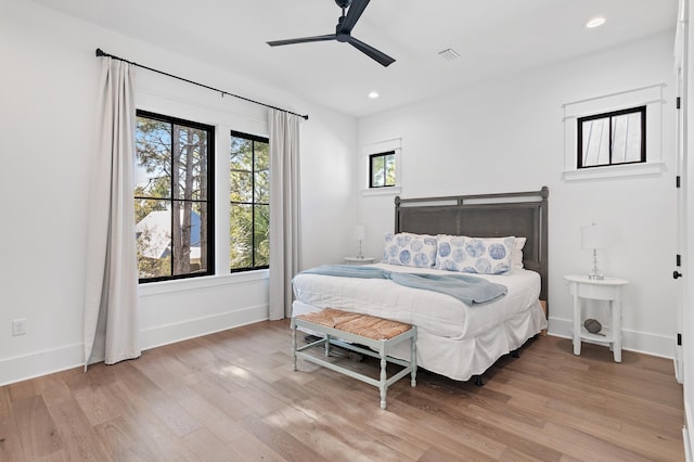 bedroom with light wood-type flooring and ceiling fan