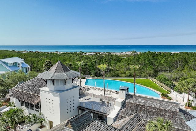 view of pool with a water view