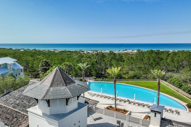 view of pool with a water view