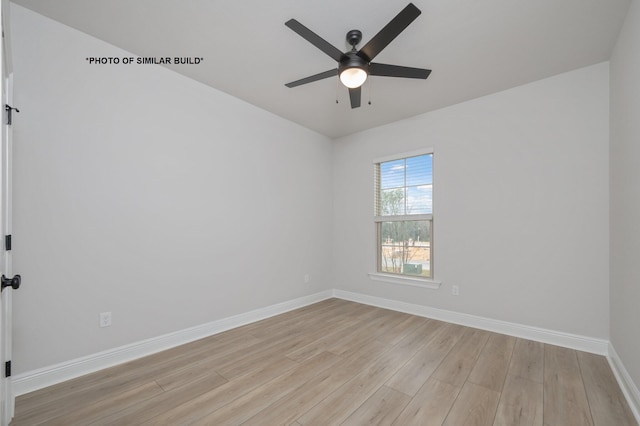 unfurnished room with ceiling fan, light wood finished floors, and baseboards