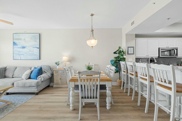 1111 Santa Rosa Blvd Unit 106, Fort Walton Beach, FL 32548 - dining room with light wood-type flooring