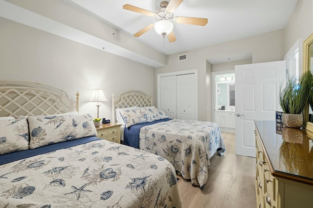 1111 Santa Rosa Blvd Unit 106, Fort Walton Beach, FL 32548 - bedroom with light wood-type flooring, ensuite bathroom, a closet, and ceiling fan