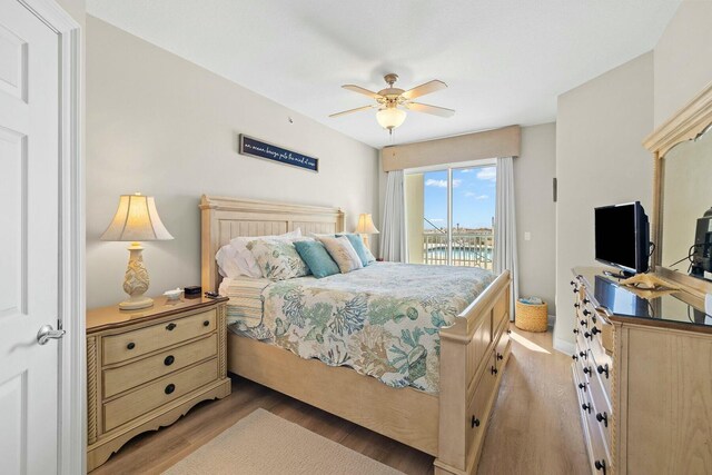 1111 Santa Rosa Blvd Unit 106, Fort Walton Beach, FL 32548 - bedroom with ceiling fan, wood-type flooring, and access to outside