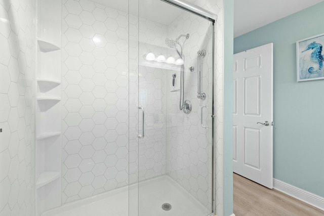 1111 Santa Rosa Blvd Unit 106, Fort Walton Beach, FL 32548 - bathroom with wood-type flooring and walk in shower