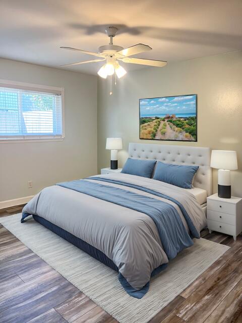 bedroom featuring hardwood / wood-style floors and ceiling fan