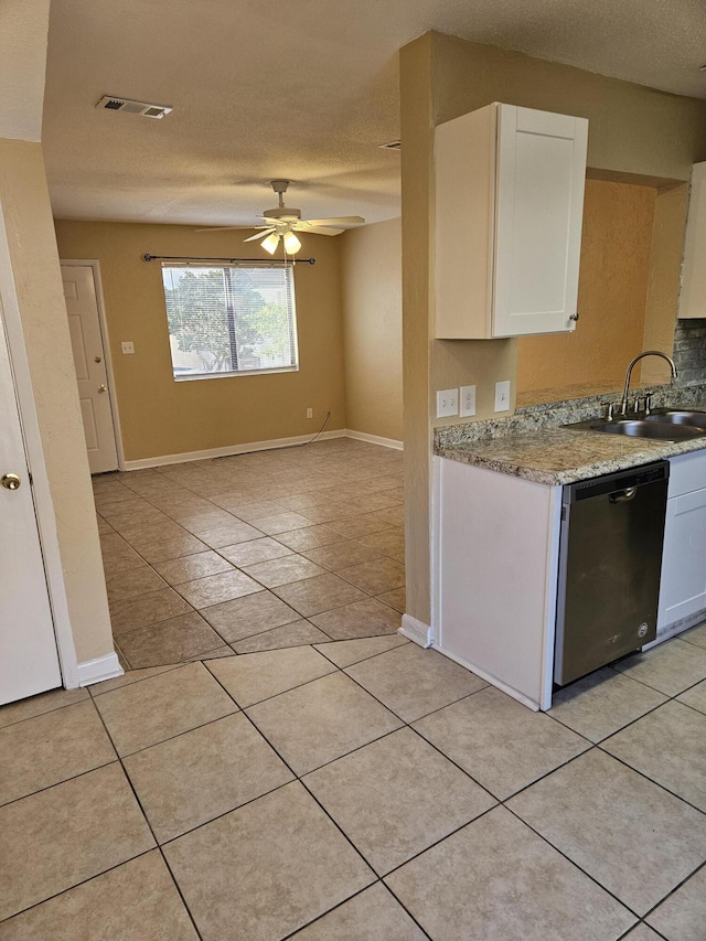 kitchen with dishwasher, ceiling fan, white cabinetry, and a textured ceiling