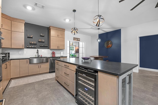 kitchen with a center island, light brown cabinetry, sink, and wine cooler