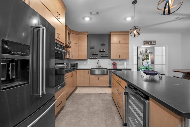 kitchen with wine cooler, pendant lighting, light brown cabinetry, a kitchen island, and appliances with stainless steel finishes