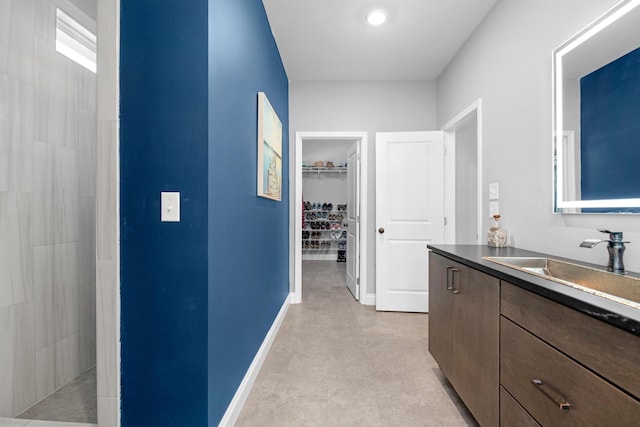 bathroom with vanity and walk in shower