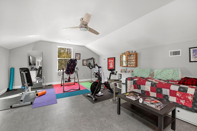 workout area featuring ceiling fan and vaulted ceiling