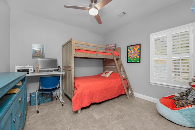 bedroom featuring light colored carpet and ceiling fan