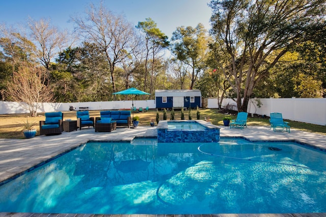 view of swimming pool featuring a patio area, an in ground hot tub, an outbuilding, and an outdoor living space