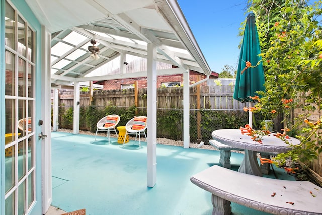 view of patio / terrace featuring a ceiling fan and fence