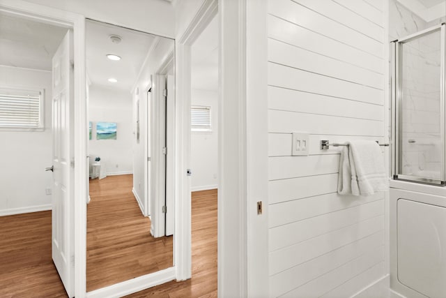 bathroom featuring an enclosed shower, wood finished floors, recessed lighting, and baseboards