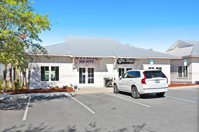 view of building exterior featuring uncovered parking