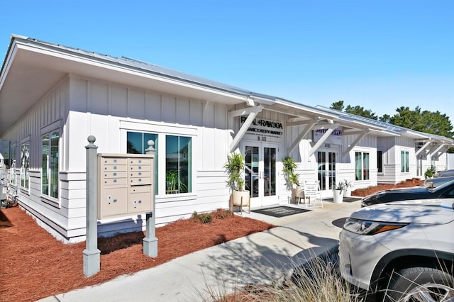 view of front of home with french doors and board and batten siding