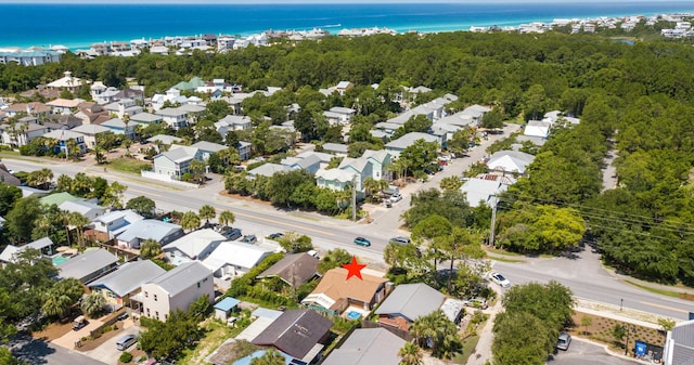 drone / aerial view featuring a water view and a residential view