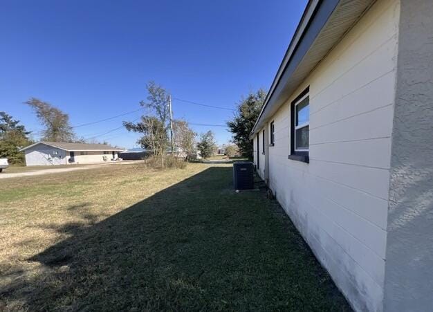 view of yard featuring central AC