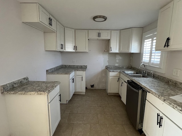 kitchen featuring white cabinetry, stainless steel dishwasher, and sink