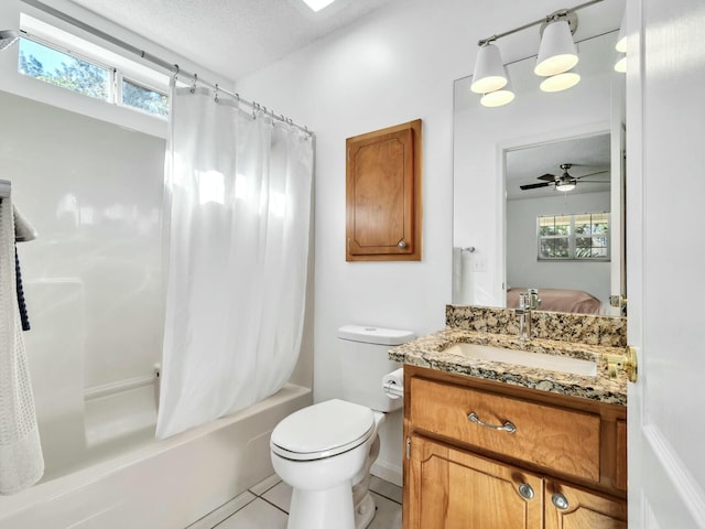 full bathroom with shower / bath combo, vanity, ceiling fan, and a healthy amount of sunlight