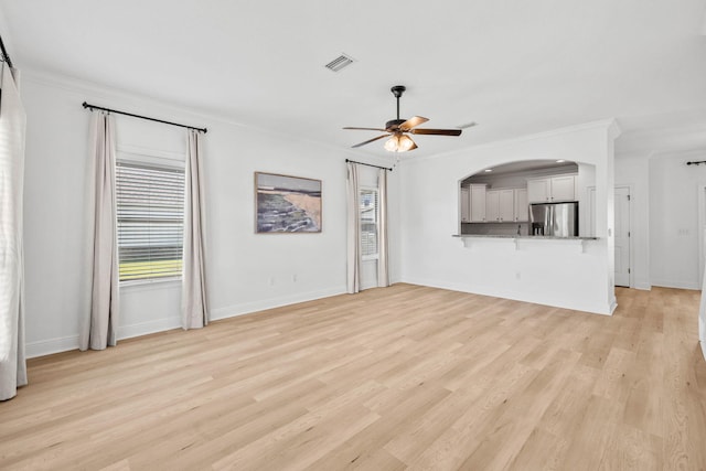 258 Tropical Breeze Dr, Santa Rosa Beach, FL 32459 - unfurnished living room with crown molding, a ceiling fan, and light wood-style flooring