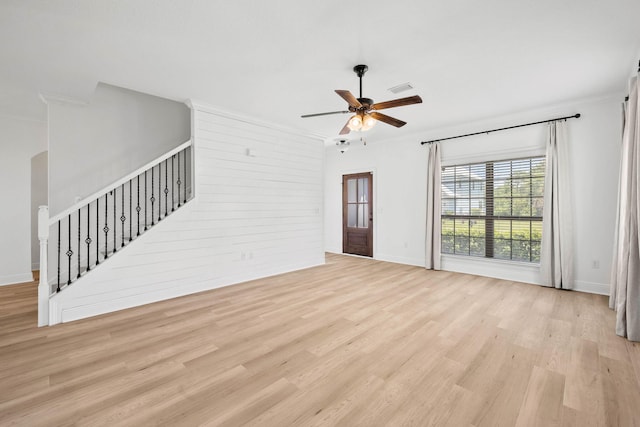 258 Tropical Breeze Dr, Santa Rosa Beach, FL 32459 - unfurnished living room with light wood-type flooring, a ceiling fan, ornamental molding, and stairs