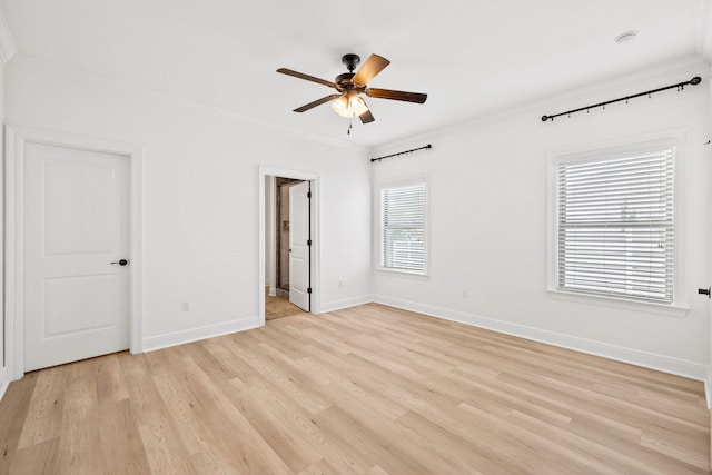 258 Tropical Breeze Dr, Santa Rosa Beach, FL 32459 - unfurnished bedroom featuring crown molding, light wood-style floors, connected bathroom, and a ceiling fan