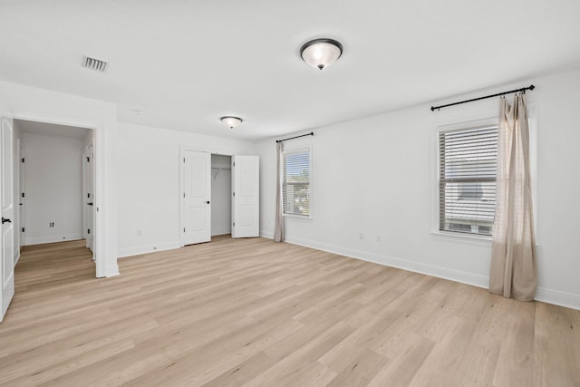 258 Tropical Breeze Dr, Santa Rosa Beach, FL 32459 - unfurnished bedroom featuring light wood finished floors and a closet
