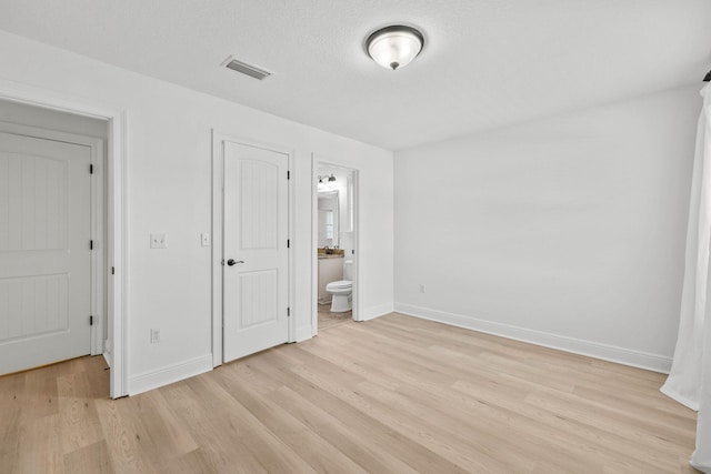 258 Tropical Breeze Dr, Santa Rosa Beach, FL 32459 - unfurnished bedroom featuring light wood finished floors and ensuite bath