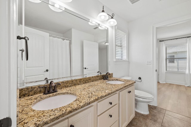 258 Tropical Breeze Dr, Santa Rosa Beach, FL 32459 - bathroom with double vanity, plenty of natural light, and tile patterned floors
